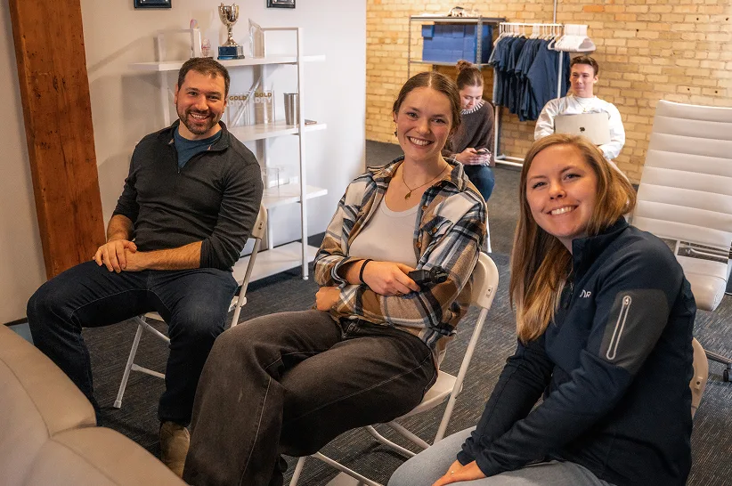 Sean, Callie and Kylee at a team meeting in the AdShark office