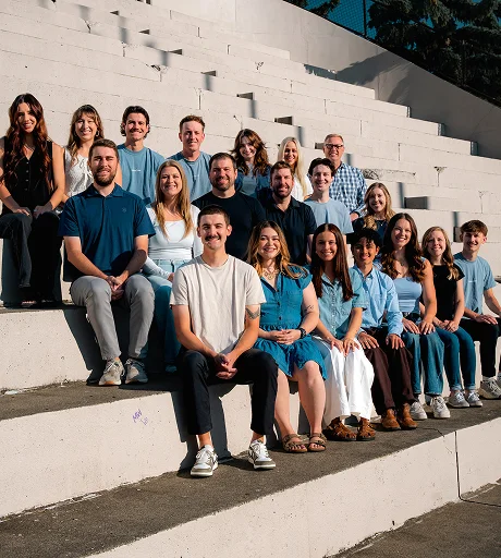 The AdShark team seated together on outdoor concrete steps