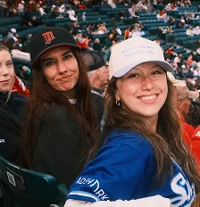 Two AdShark team members at a Redhawks game