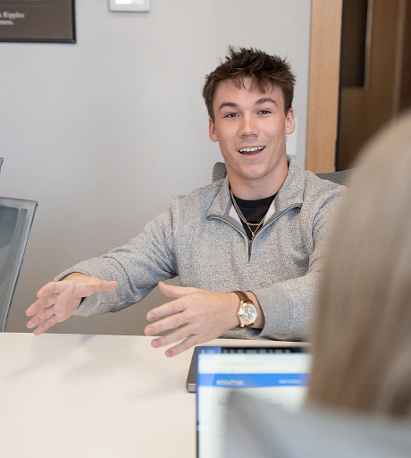 An AdShark strategist meeting with a client