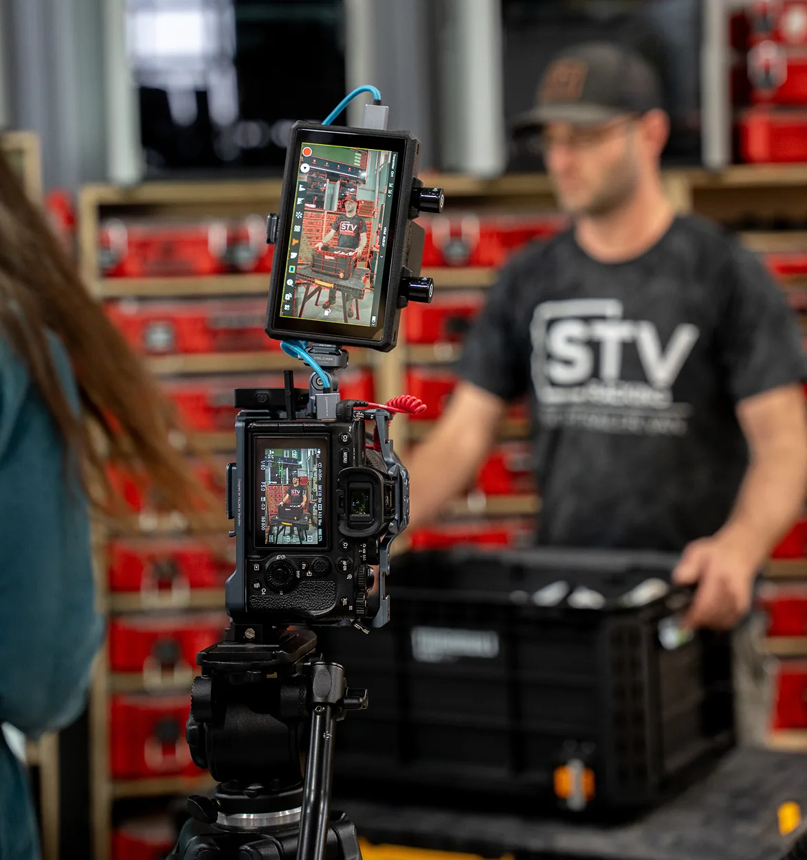 An AdShark videographer filming product content on location at a client's warehouse