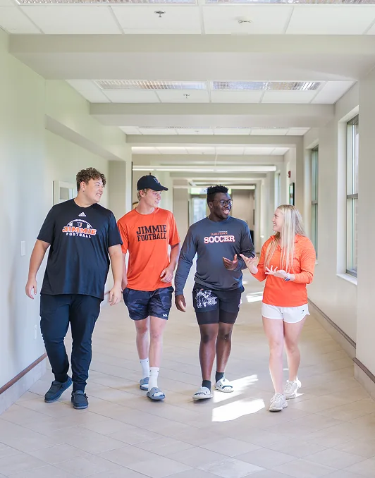 University of Jamestown students walking together on campus