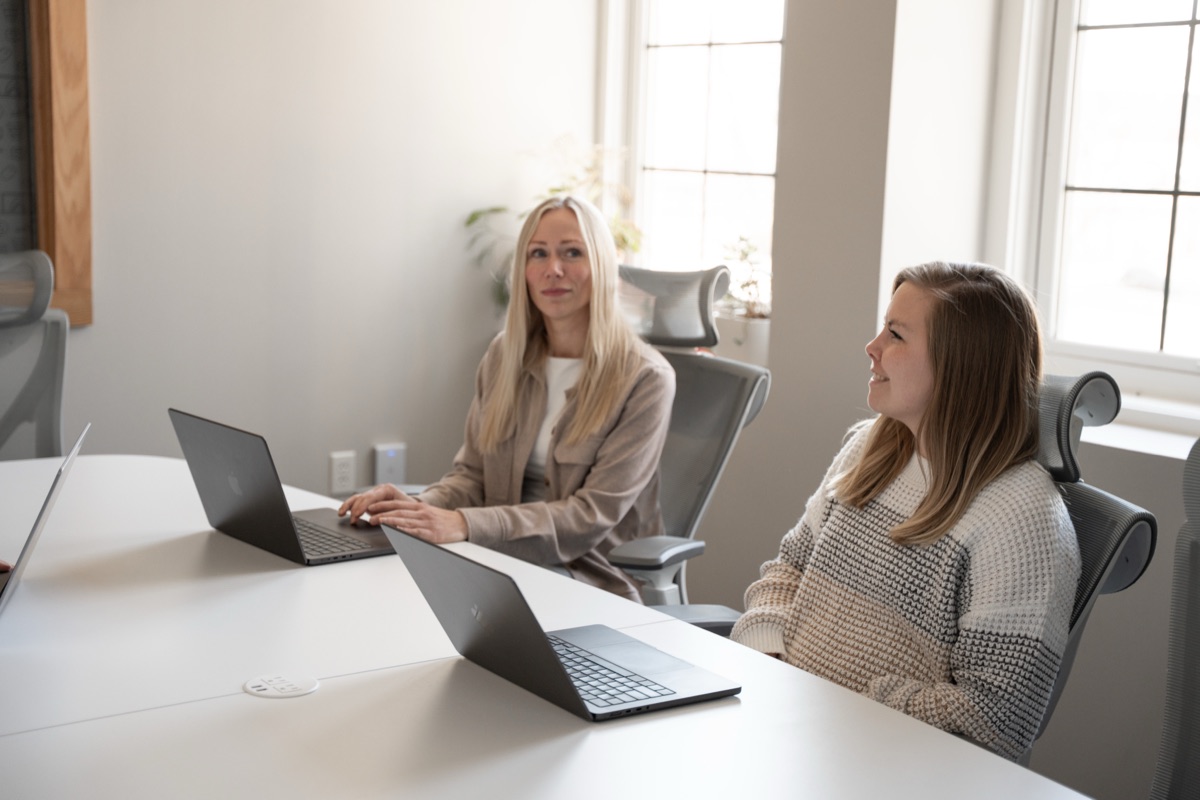 AdShark team members meeting with a client
