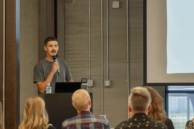 An AdShark strategist presenting to a room of attendees