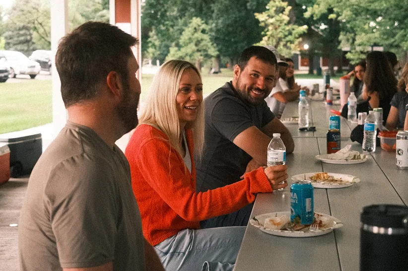 AdShark team members with clients at an event