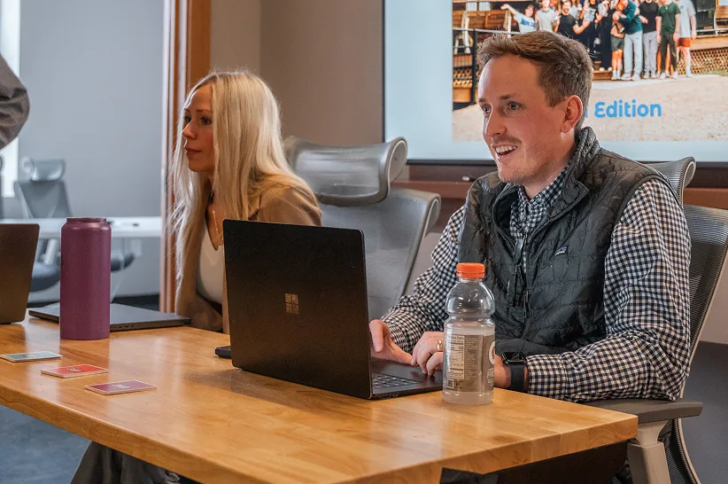 Two AdShark strategists reviewing account performance together
