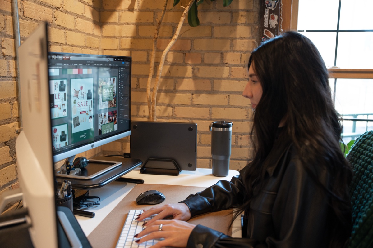 AdShark designer building display ad creative at a workstation