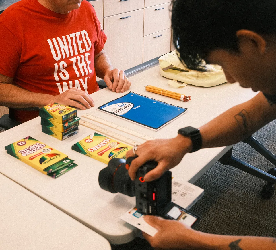 An AdShark videographer photographing school supplies on a product shoot