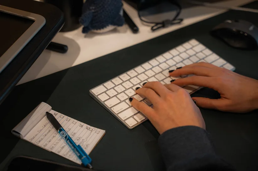 A developer working on a website at a desktop workstation
