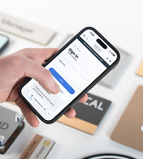 A responsive AdShark-built website on a mobile phone